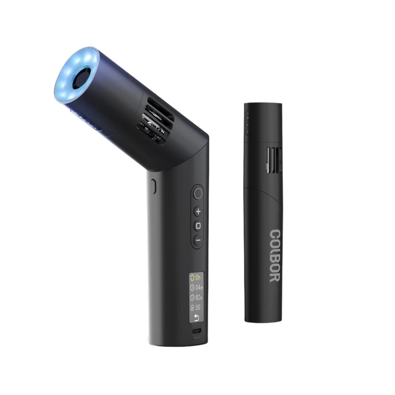 Black handheld device with a blue light on a white background